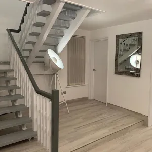 stairs with light and mirror